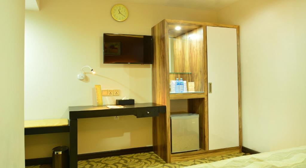 Postel nebo postele na pokoji v ubytování Pearl City Hotel