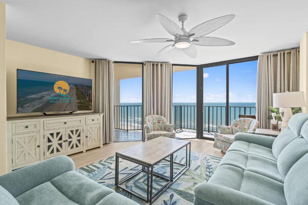 a living room with a couch and a tv at The Summit #9E - Oceanfront in Myrtle Beach
