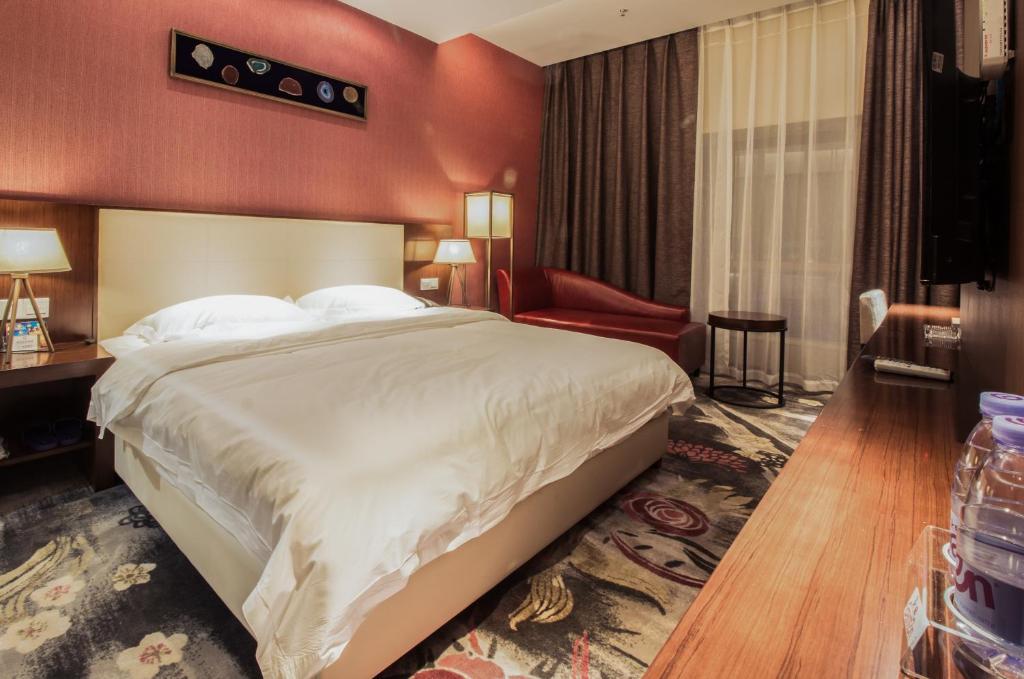 Postel nebo postele na pokoji v ubytování Milton Hotel