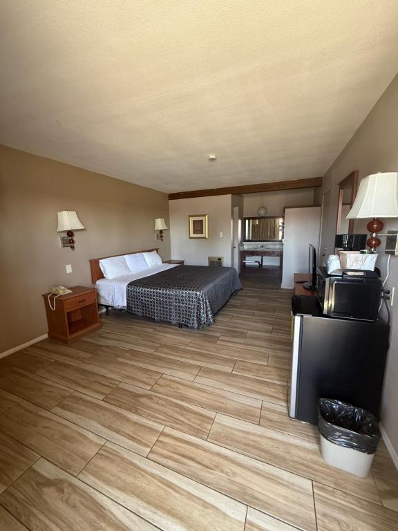 Postel nebo postele na pokoji v ubytování Torch Lite Lodge