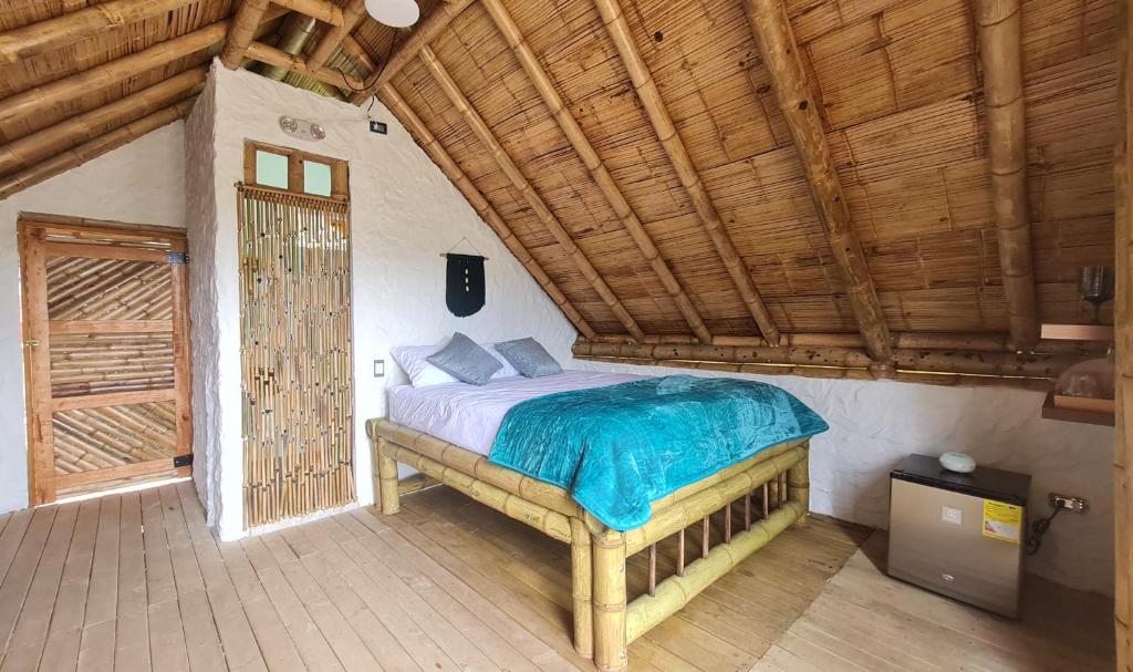 Voodi või voodid majutusasutuse Hass Glamping Jericó toas