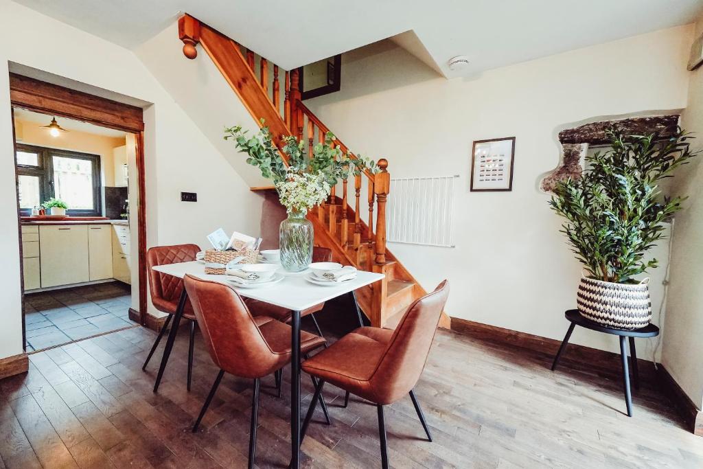 a dining room with a table and chairs at Cottage near Matlock Bath & Cromford in Middleton