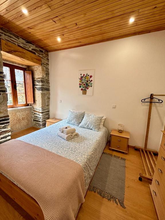 Postel nebo postele na pokoji v ubytování O Chouzal