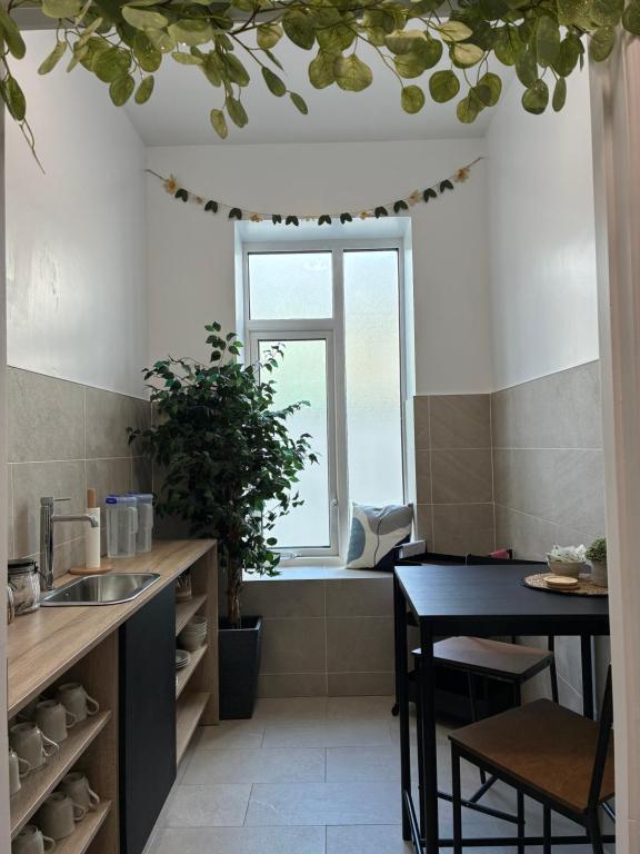 a kitchen with a table and a window at Carrick Gate in Carrick