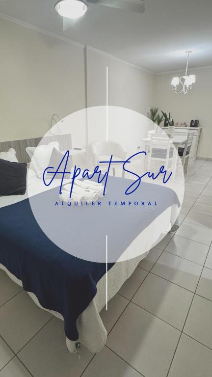 a round bed in a bedroom with a sign on it at ApartSur Santa Fe in Santa Fe