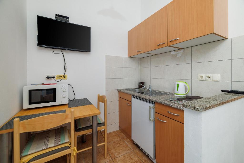 Kuchyňa alebo kuchynka v ubytovaní Apartment Toma