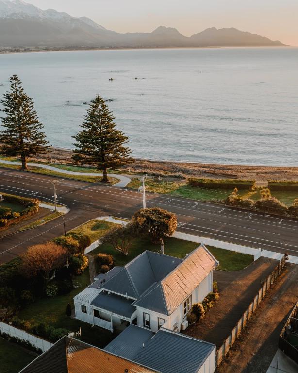 an aerial view of a house next to the water at Beachfront Villa, Spacious, Mountain Outlook - KK87184 in Kaikoura