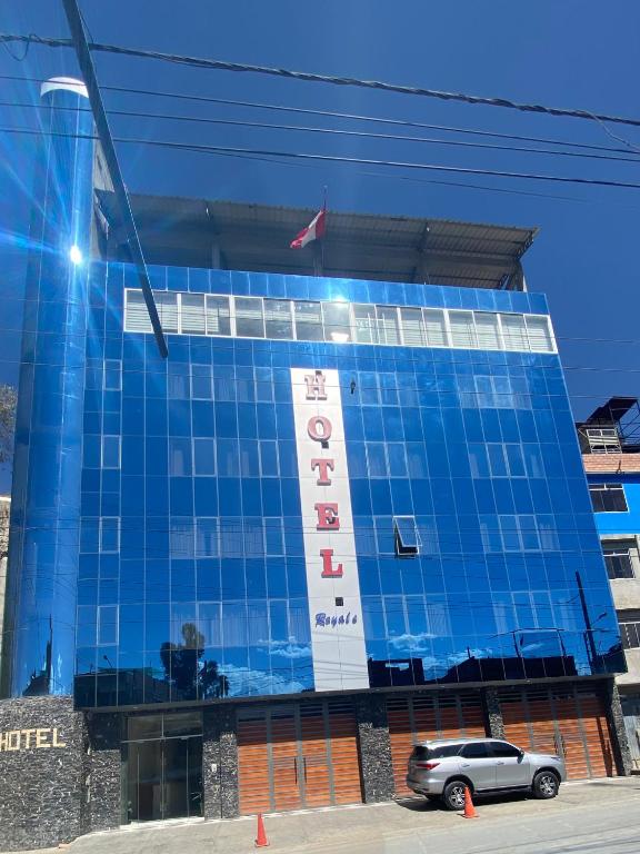 a car parked in front of a building at Los ROYALS Hotel Huaraz in San Antonio