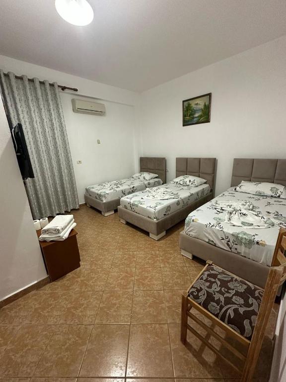 Postel nebo postele na pokoji v ubytování Hotel Rixhi