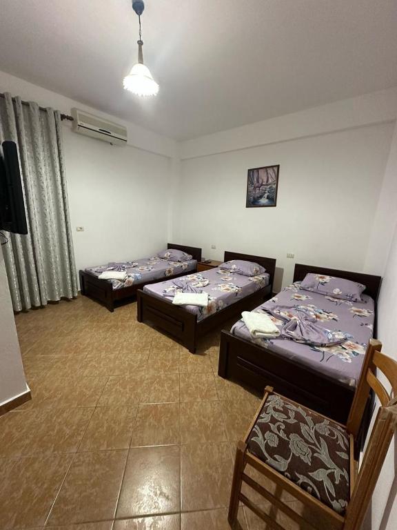 Postel nebo postele na pokoji v ubytování Hotel Rixhi