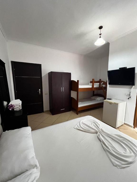 Postel nebo postele na pokoji v ubytování Hotel Rixhi