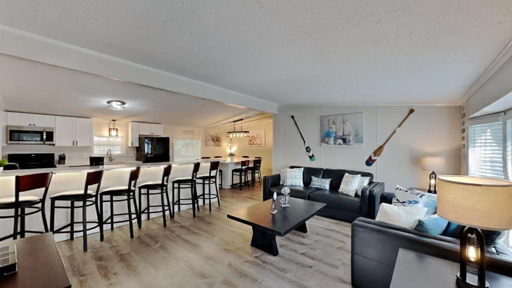 a living room with a couch and a bar at Put-in-Bay Island Club #4 in Put-in-Bay