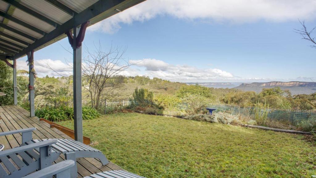 a view from the porch of a house at Stunning Cliff Face and Valley Views in Katoomba