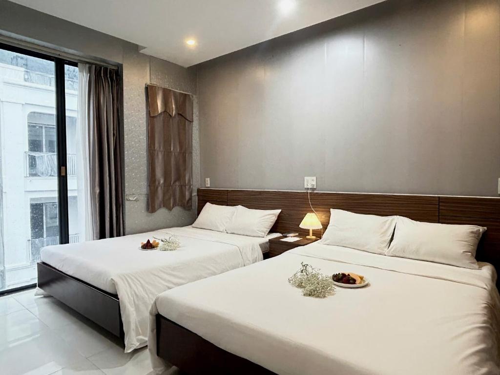 Postel nebo postele na pokoji v ubytování BeSea Hotel