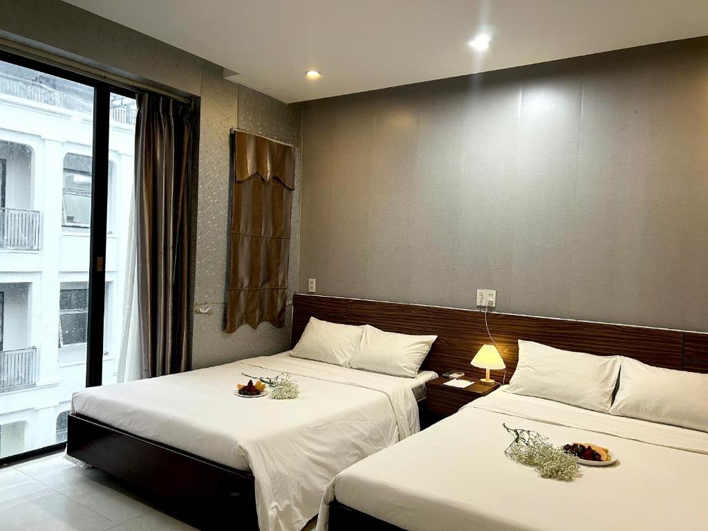 Postel nebo postele na pokoji v ubytování BeSea Hotel
