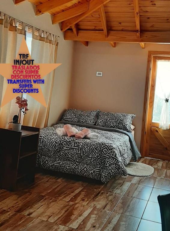 a bedroom with a bed and a wooden floor at your-space in El Calafate