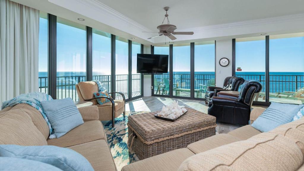 a living room with a view of the ocean at Phoenix IX 508 condo in Orange Beach