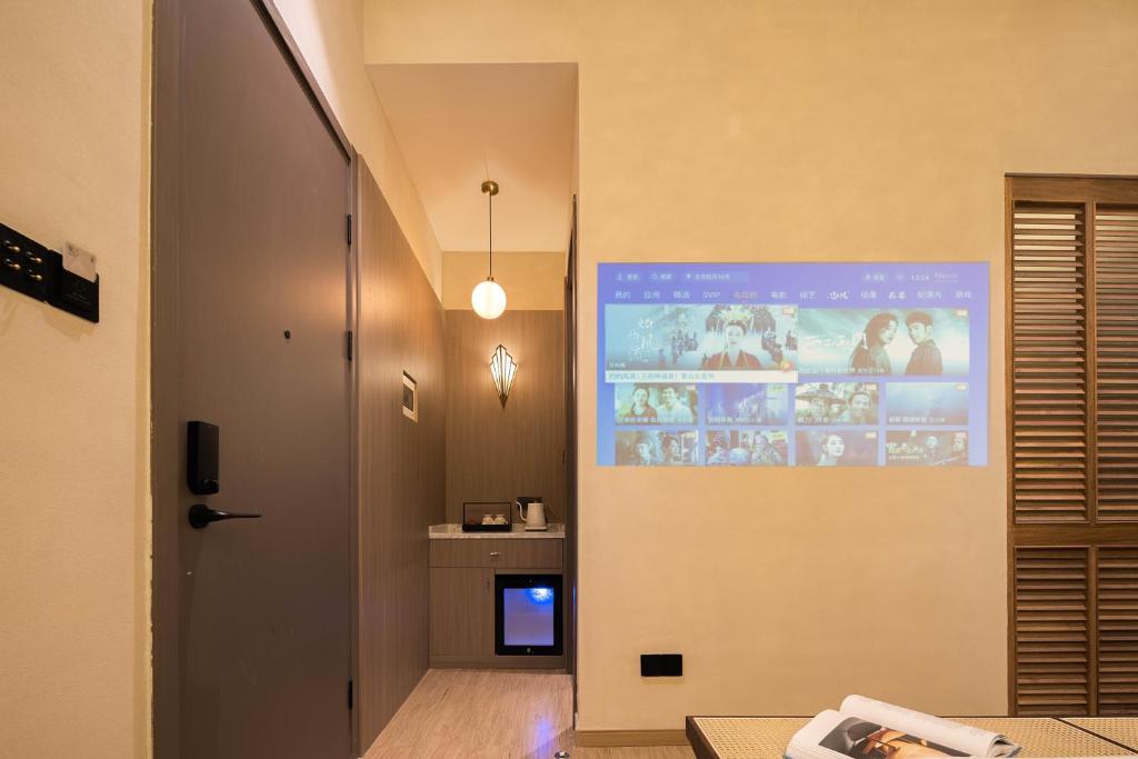 TV a/nebo společenská místnost v ubytování Mudita Hotel
