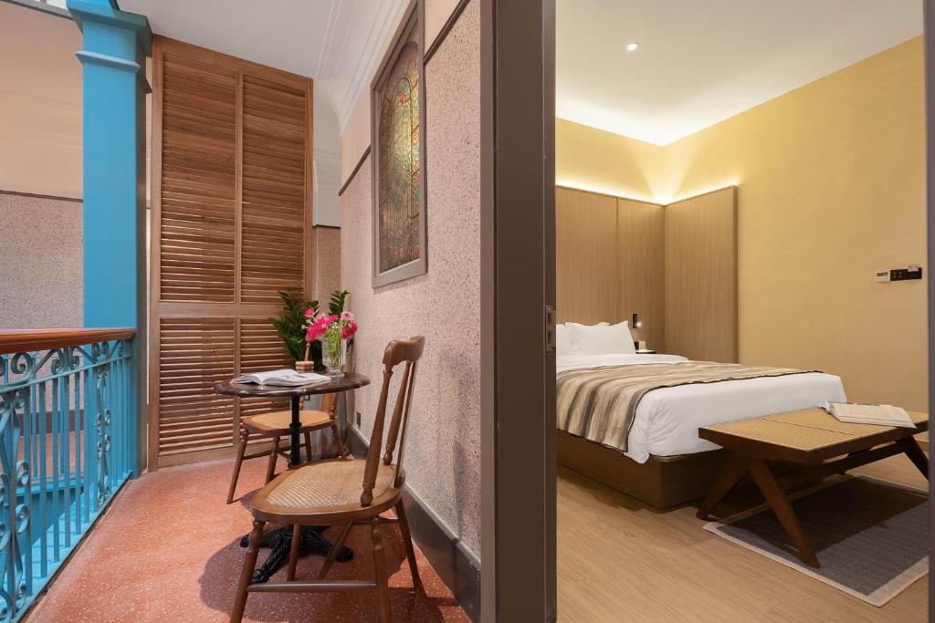 Postel nebo postele na pokoji v ubytování Mudita Hotel