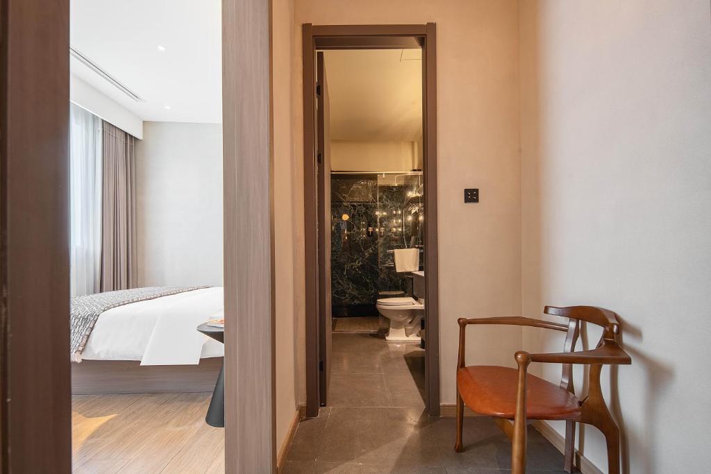 Postel nebo postele na pokoji v ubytování Mudita Hotel