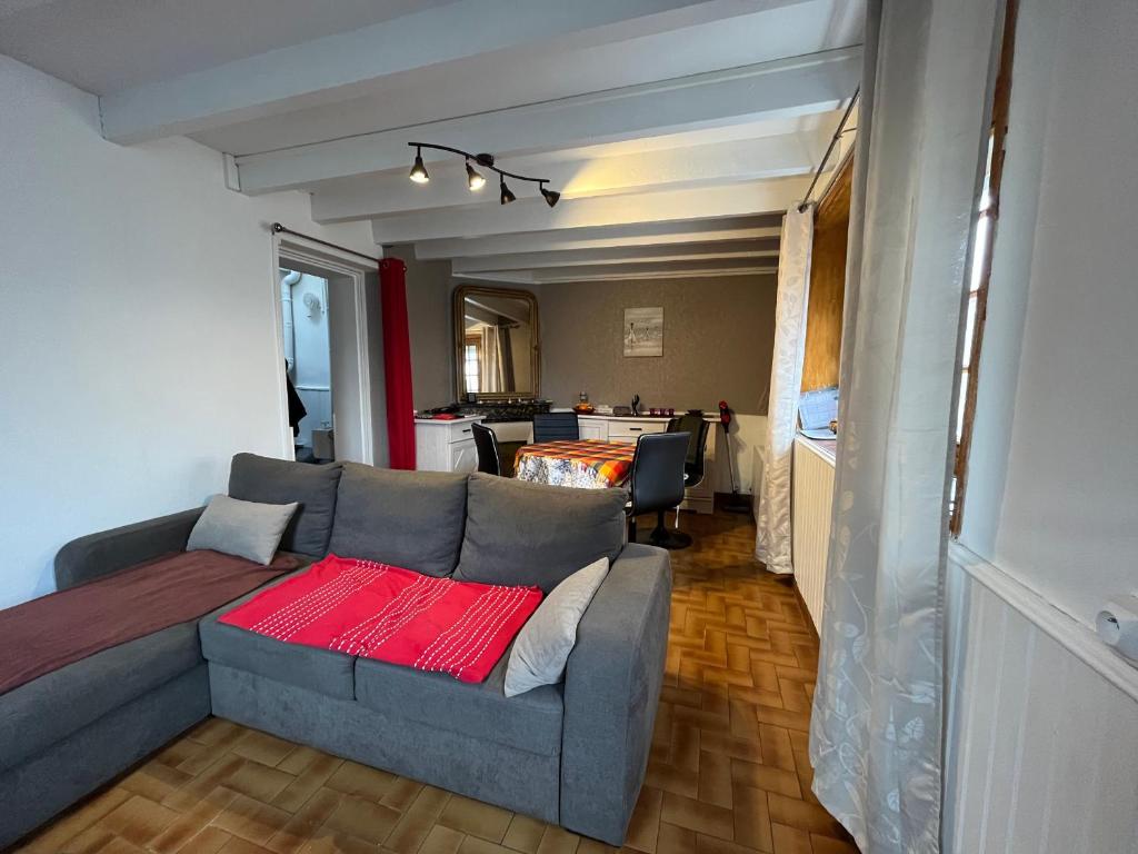 a living room with a couch and a table at Maison de ville au Croisic avec WIFI et animaux admis - 4 personnes - FR-1-843-6 in Le Croisic