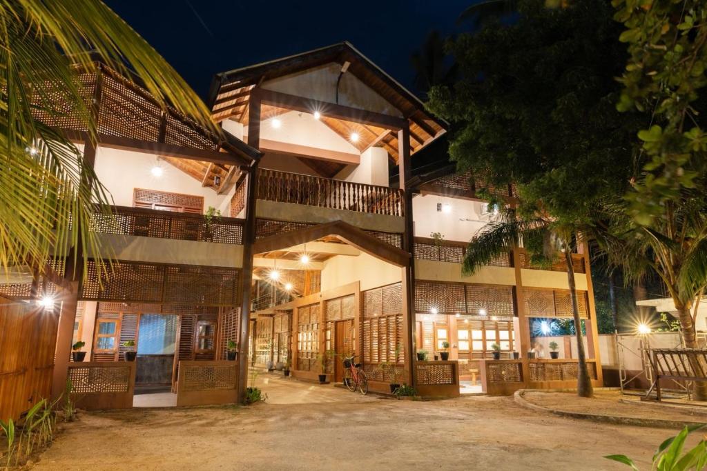 an exterior view of a building at night at Sunrise Cabanas Arugam Bay in Arugam Bay