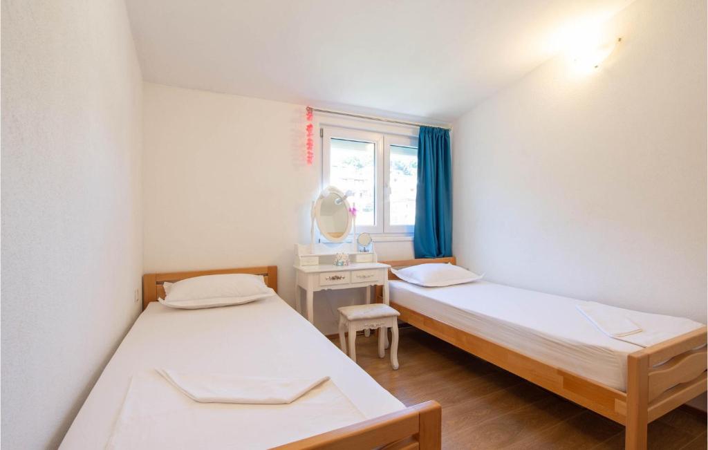 Posteľ alebo postele v izbe v ubytovaní 3 Bedroom Beautiful Apartment In Solin