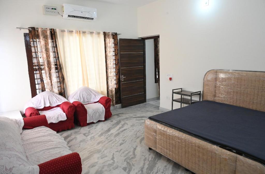 Ένα ή περισσότερα κρεβάτια σε δωμάτιο στο The Villas Homestay