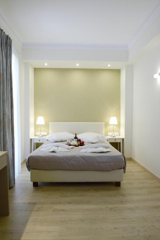 Uma cama ou camas num quarto em Phidias Hotel by Oniro