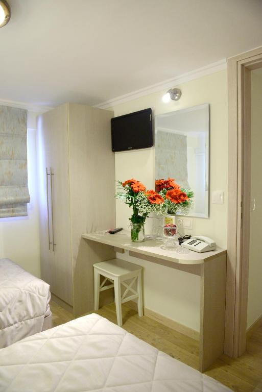 Uma cama ou camas num quarto em Phidias Hotel by Oniro