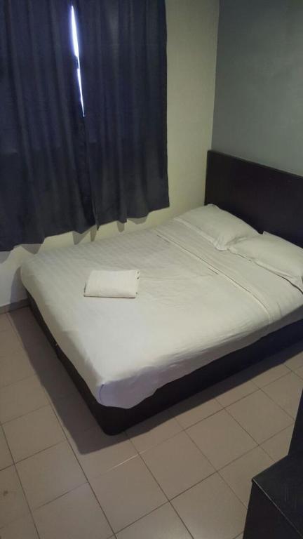 Postel nebo postele na pokoji v ubytování Tiong Nam Hotel