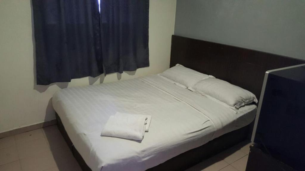 Postel nebo postele na pokoji v ubytování Tiong Nam Hotel