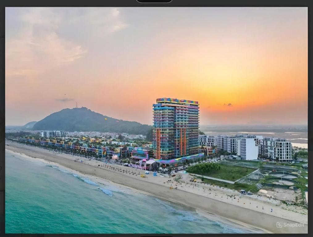 an aerial view of a beach at sunset at Thành phố Flamingo Hải Tiến City Ibiza Resort Biển 5 Sao KS 21 tang -SeaNest 609 in Thanh Hóa