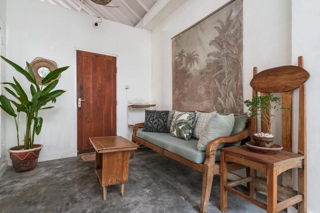 a living room with a couch and a table at European-Inspired Villa Near Beach & Dining in Gili Trawangan