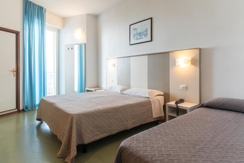 Postel nebo postele na pokoji v ubytování Hotel Concord