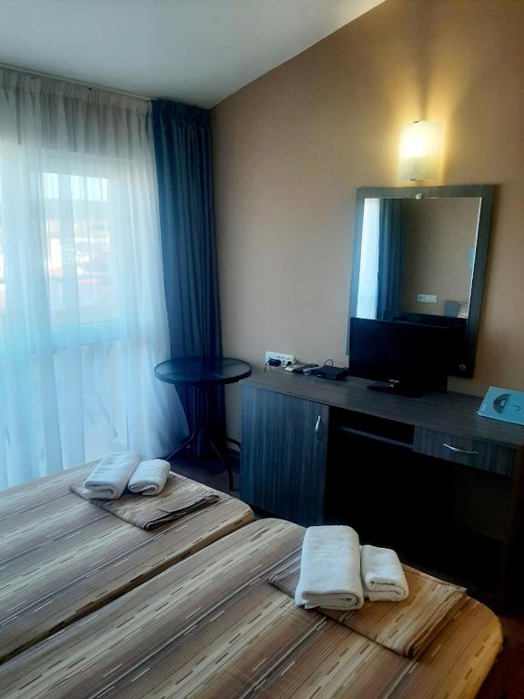 Postel nebo postele na pokoji v ubytování Hotel Ray