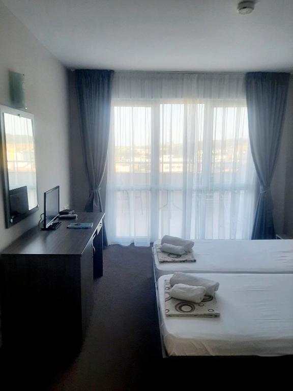 Postel nebo postele na pokoji v ubytování Hotel Ray