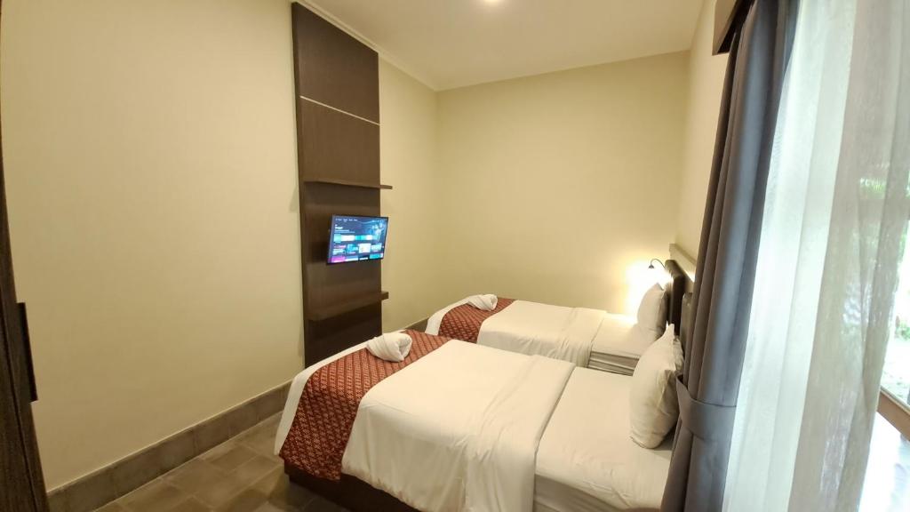 Yuwono Hotel & Villa Malioboro客房内的一张或多张床位