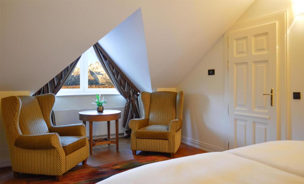 Postel nebo postele na pokoji v ubytování Grand Hotel Kempinski High Tatras