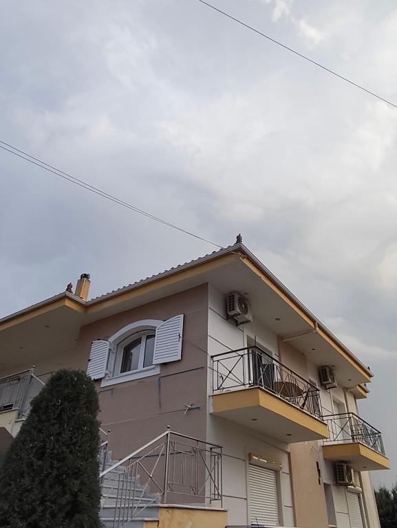 a building with balconies on the side of it at Peter appartments in Vrachati