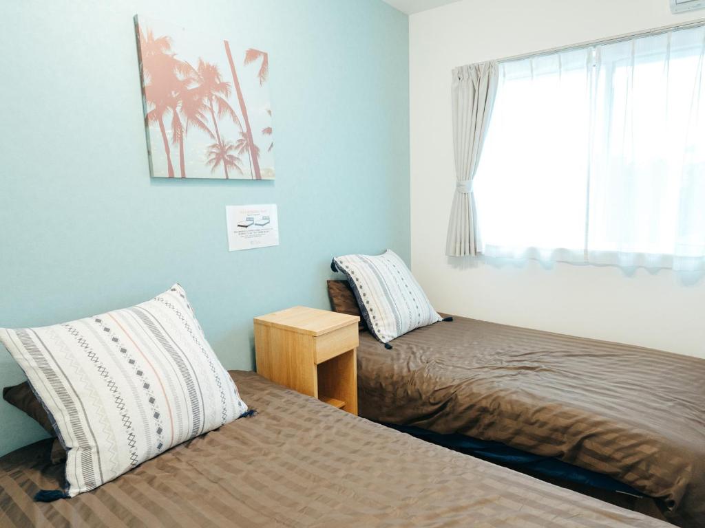 Postel nebo postele na pokoji v ubytování Base in Onnason,Okinanawa