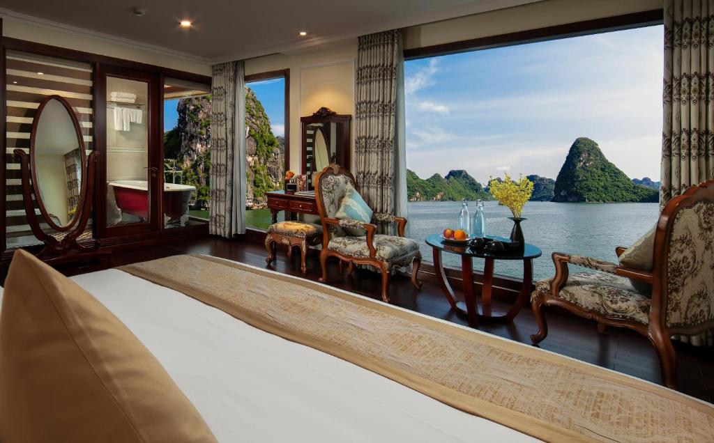 a room with a view of the water at Emperor Cruises Legacy Ha Long in Ha Long