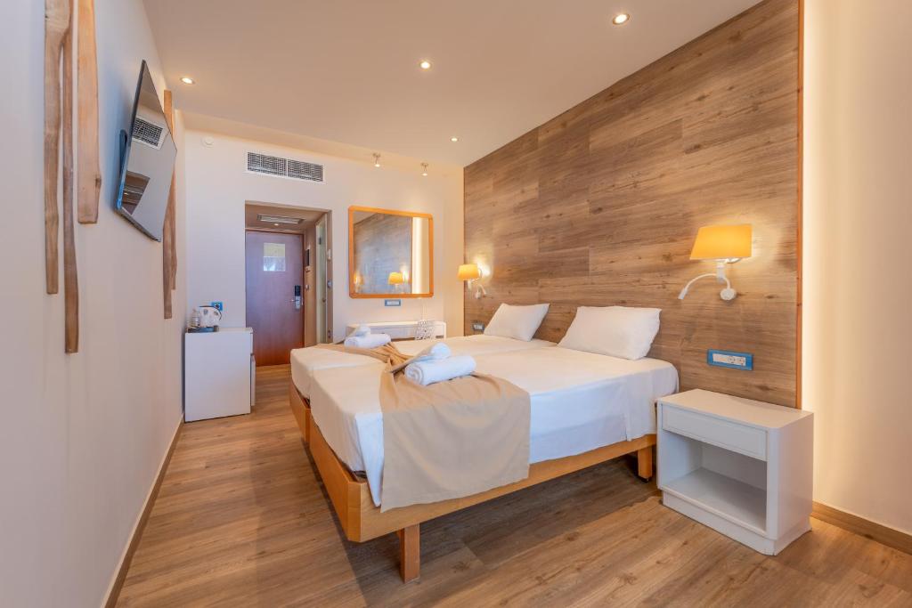 Łóżko lub łóżka w pokoju w obiekcie Arte Hotel