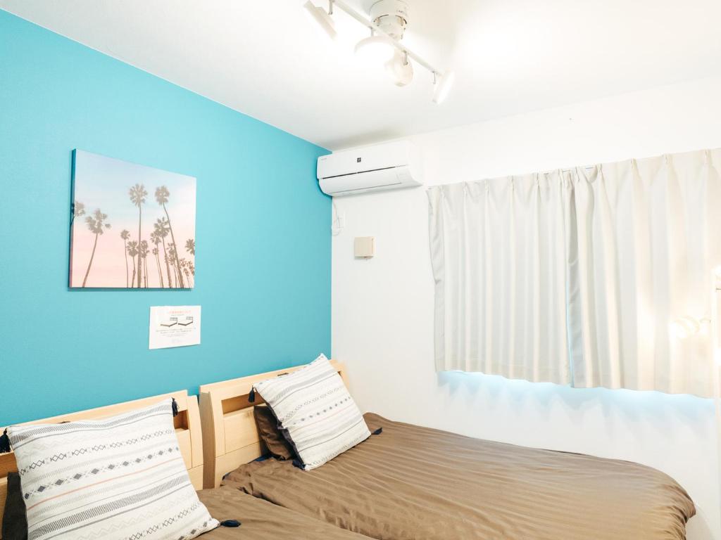 Postel nebo postele na pokoji v ubytování Base in Onnason,Okinanawa