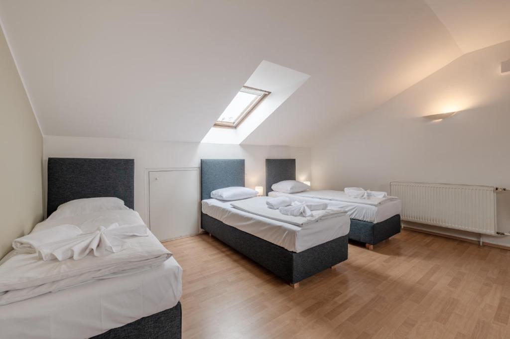 Postel nebo postele na pokoji v ubytování Hotel Brixen