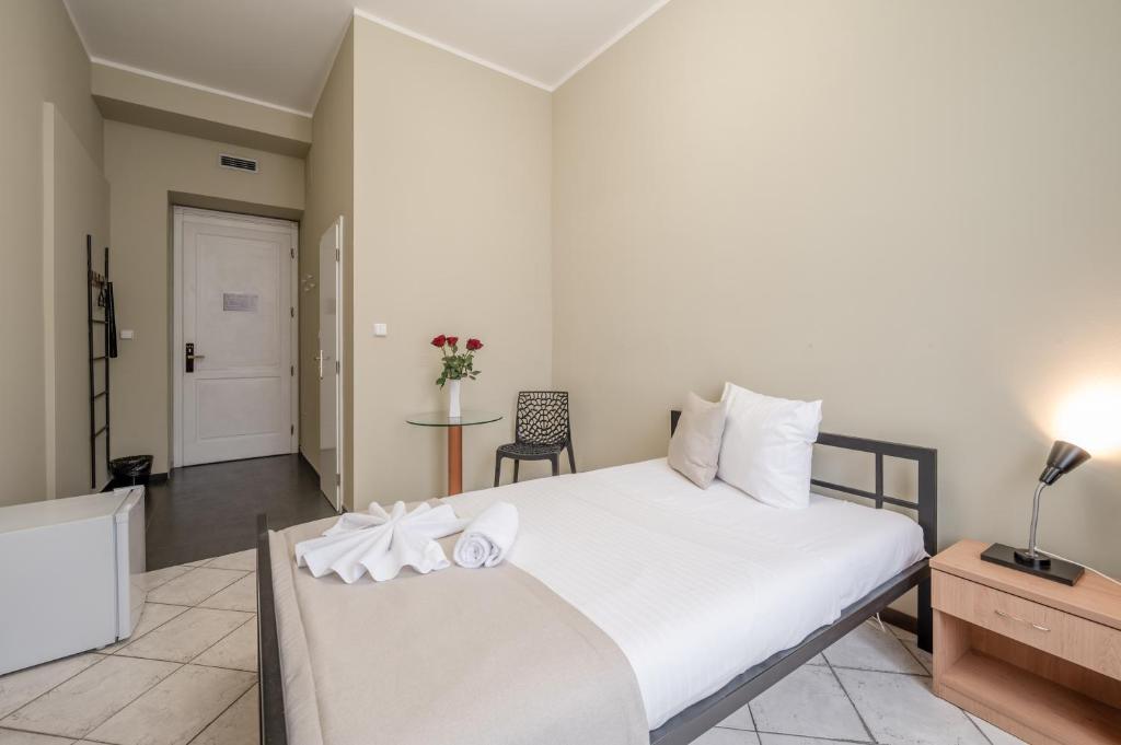 Postel nebo postele na pokoji v ubytování Hotel Brixen