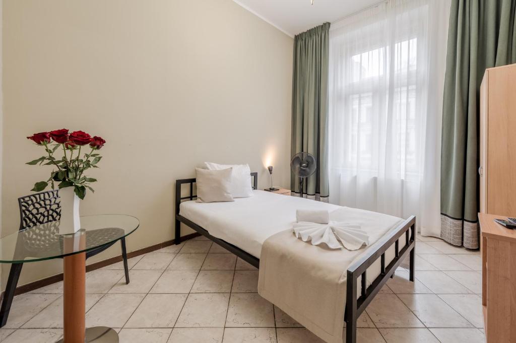 Postel nebo postele na pokoji v ubytování Hotel Brixen