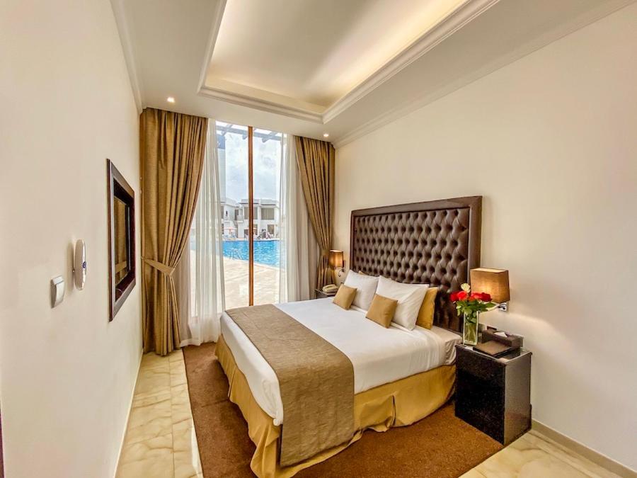 Postel nebo postele na pokoji v ubytování Mirage Bab Al Bahr Hotel
