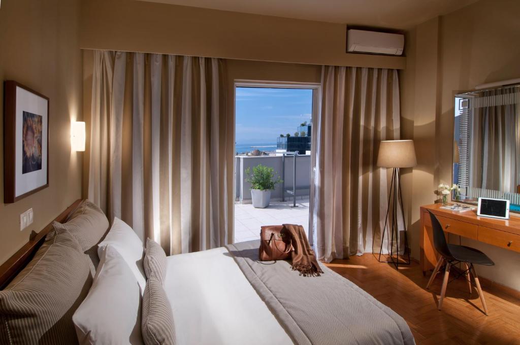Postel nebo postele na pokoji v ubytování Hotel Delfini