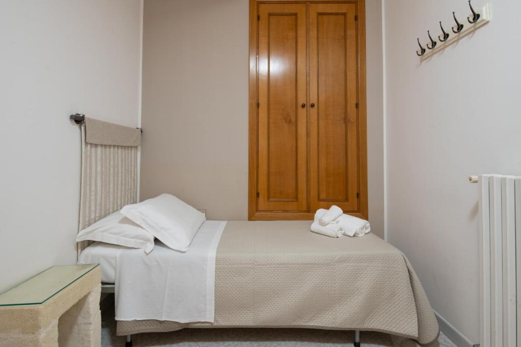 Posteľ alebo postele v izbe v ubytovaní Piccolo Hotel Villa Rosa